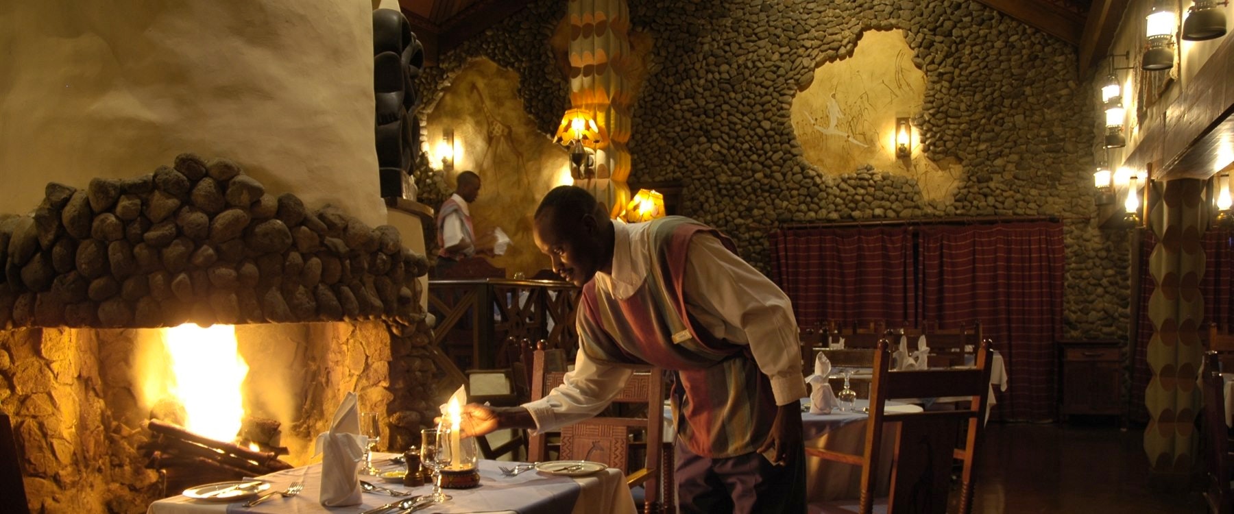 Dinner by fireplace at Ngorongoro Serena Safari Lodge
