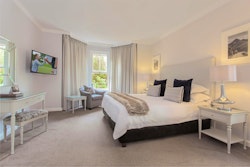 one bedroom suite lounge and patio at fancourt hotel george