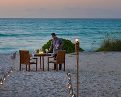 Set up romantic beach dinner at COMO Parrot Cay, Turks and Caicos