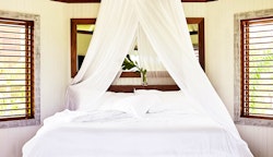 Two Bedroom, Two Story Beach Hut bedroom at GoldenEye, Jamaica