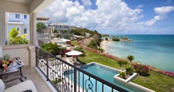 Enjoy the ocean views on a private terrace at Rock Cottage at Blue Waters, Antigua