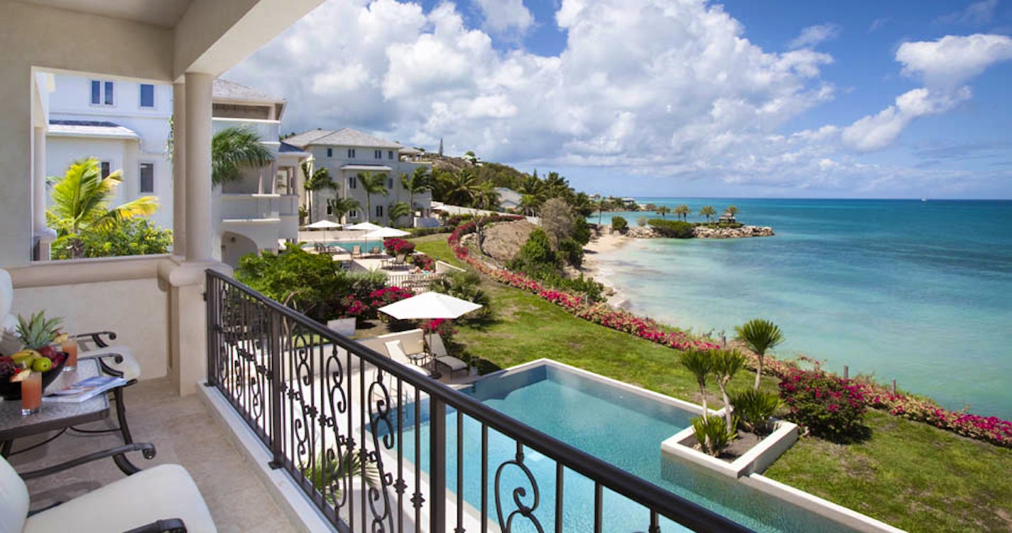 Enjoy the ocean views on a private terrace at Rock Cottage at Blue Waters, Antigua