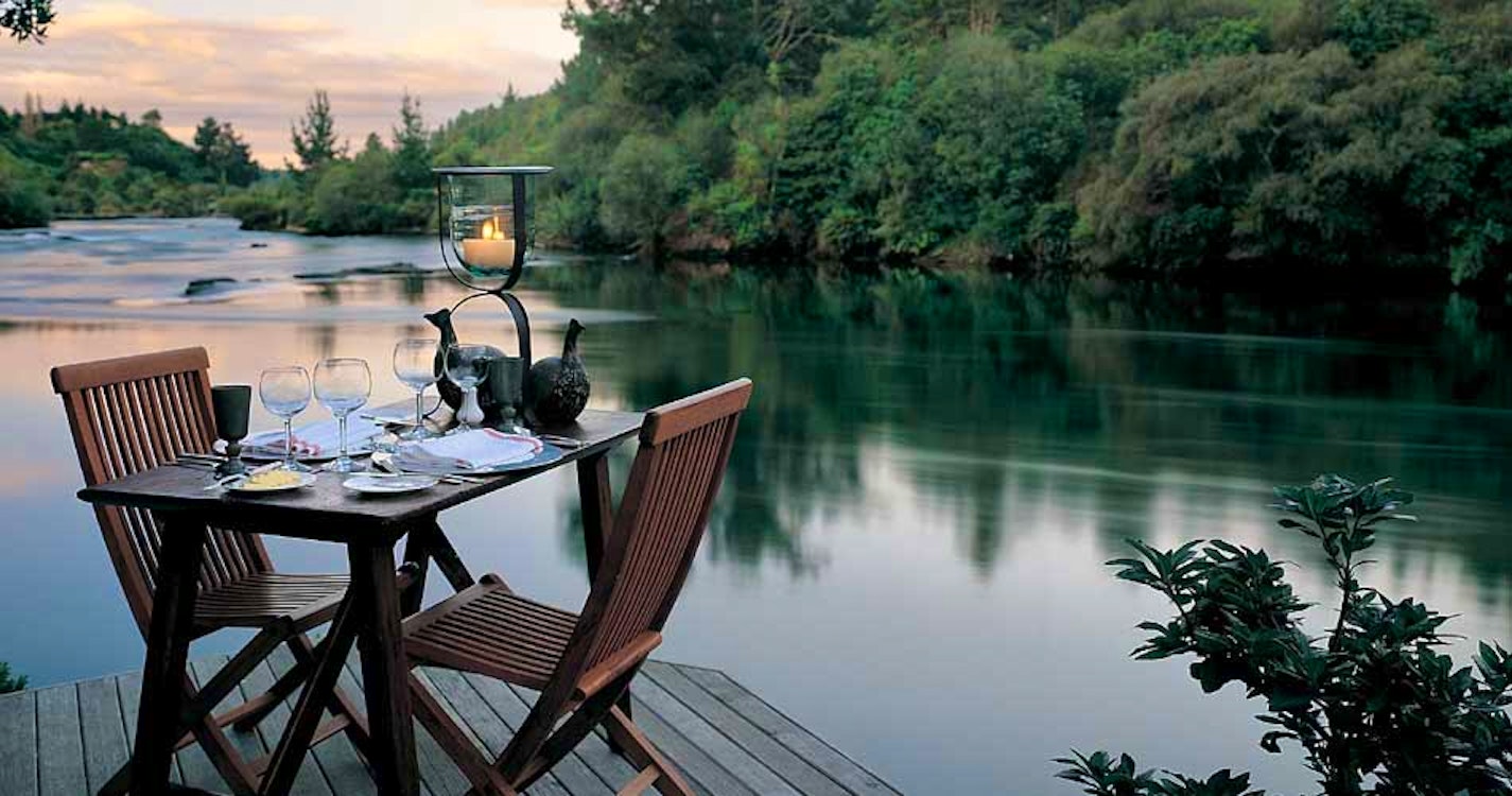 Dining next to the lake at Huka Lodge Lake Taupo