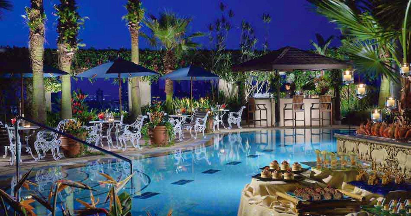 Swimming pool in the evening at Four Seasons Hotel Singapore