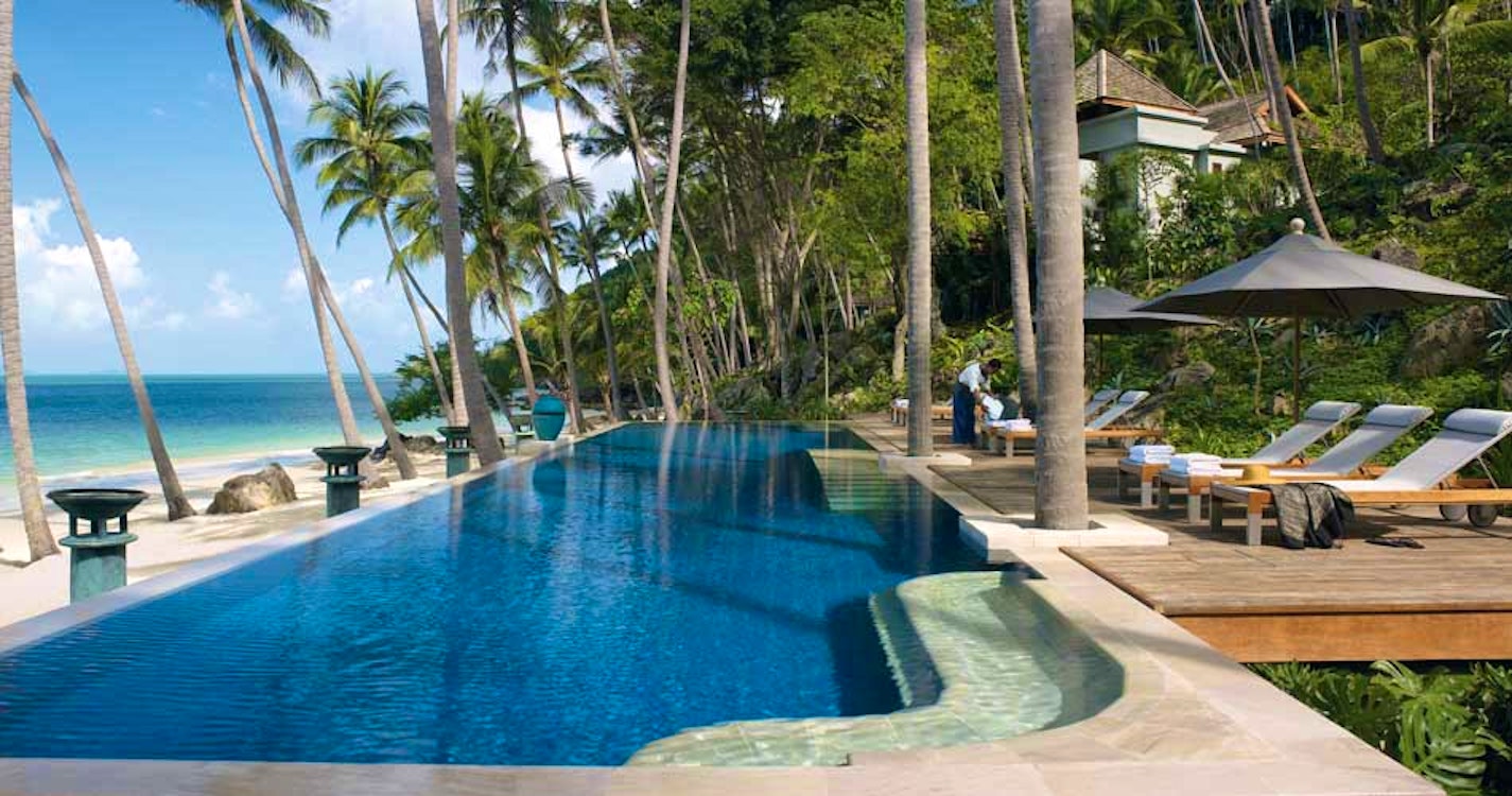 Relax poolside at Four Seasons Resort Koh Samui, Thailand