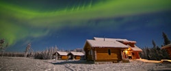 Northern lights above Alpine Chalet Fireweed at Northern Lights Resort & Spa, Yukon