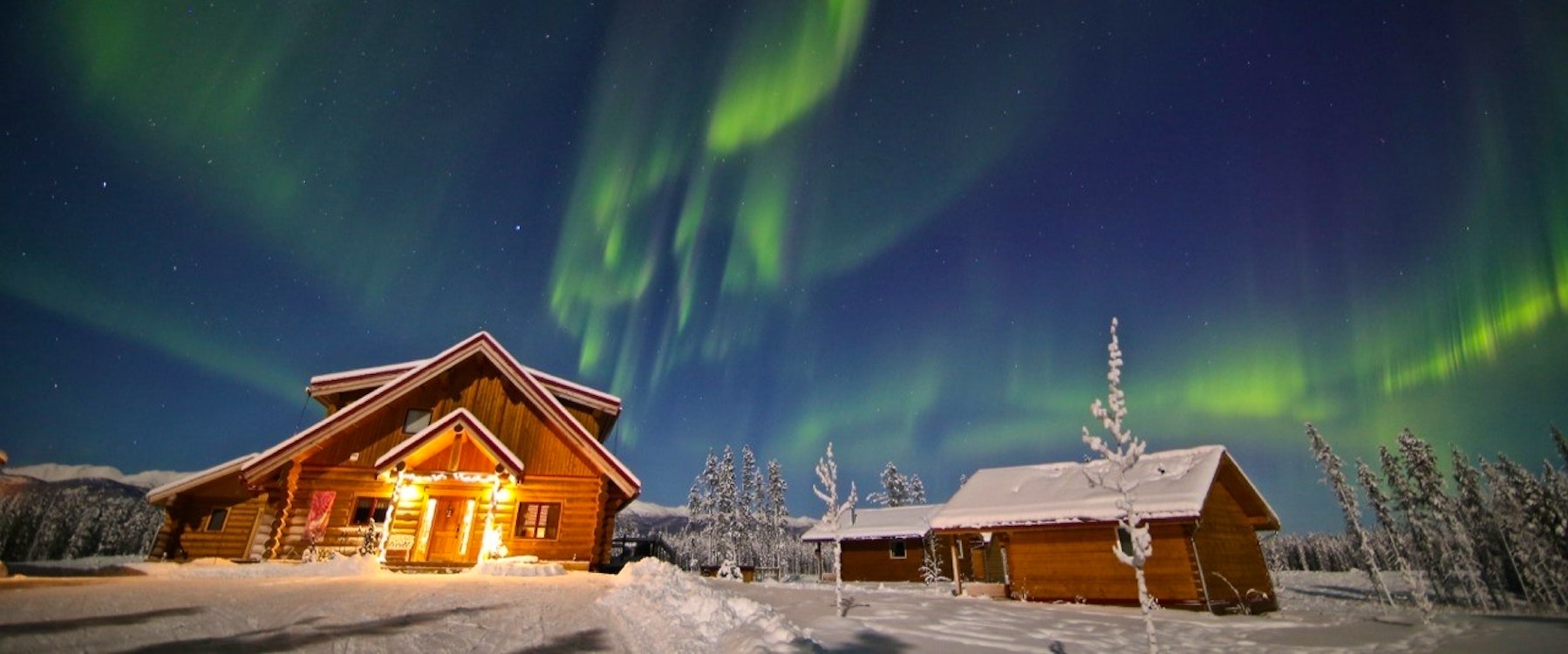 Aurora above Northern Lights Resort & Spa, Yukon