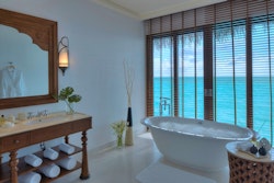 Water villa bathroom at The Residence Maldives, Indian Ocean 