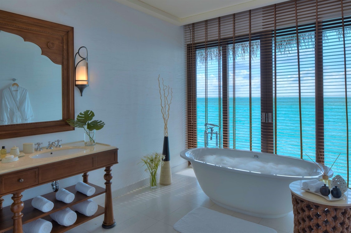 Water villa bathroom at The Residence Maldives, Indian Ocean 