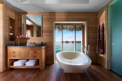 bathroom of overwater bungalow suite at four seasons bora bora resort french polynesia