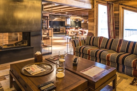 Lounge with fire at Chalet Ambre