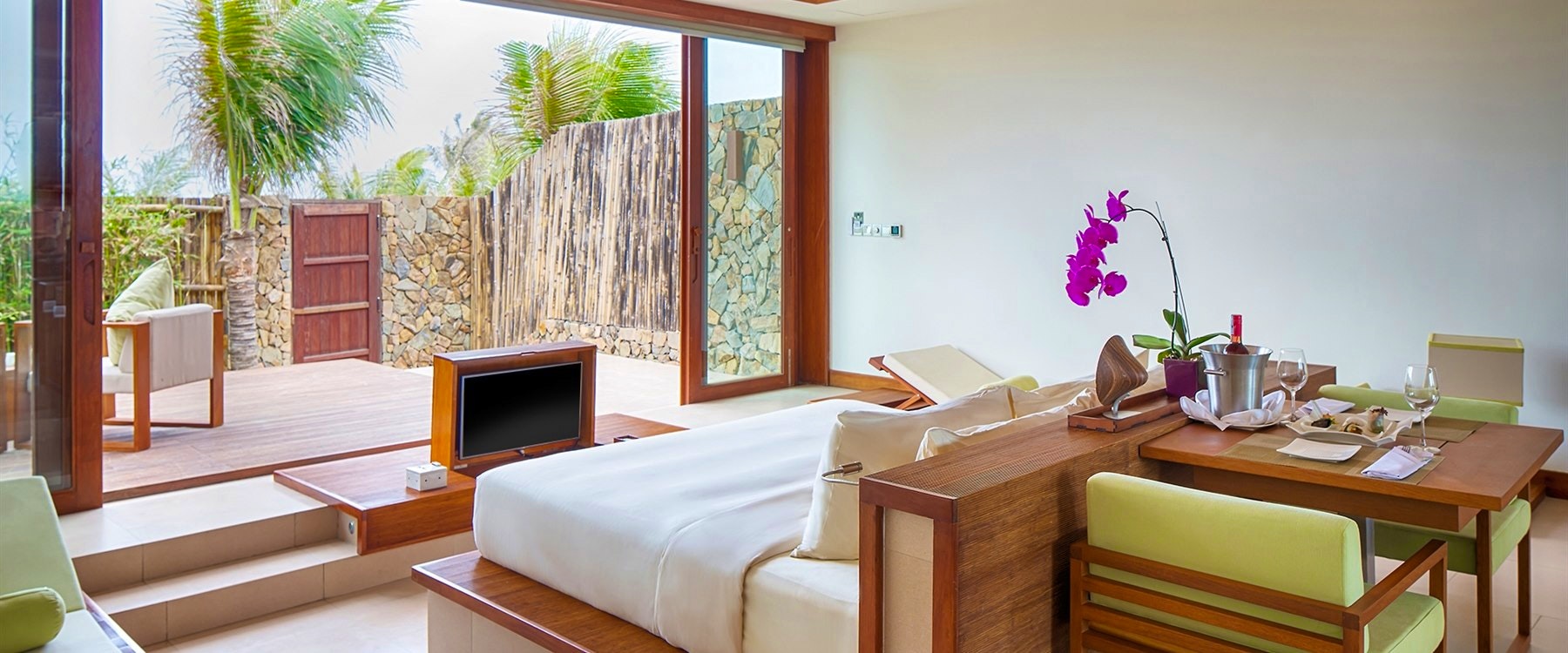 Chic suite bedroom at Fusion Resort Nha Trang
