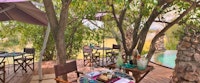 Outdoor dining area at &Beyond Grumeti Serengeti Tented Camp