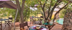 Outdoor dining area at &Beyond Grumeti Serengeti Tented Camp
