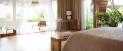 Bedroom overlooking the ocean at Zanzibar White Sand Luxury Villas and Spa