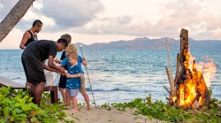 buddy and children toasting marshmallows at nanuku resort fiji