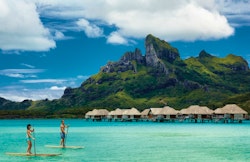 paddle boarding at four seasons bora bora resort french polynesia