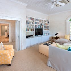 tv room and library at gardenia villa barbados