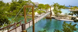 Bridge connecting the resort to the beautiful beach at GoldenEye, Jamaica