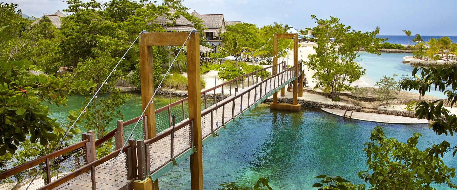 Bridge connecting the resort to the beautiful beach at GoldenEye, Jamaica 