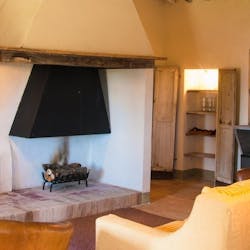 Living Room with Fireplace at Villa Il Cocceto , Tuscany