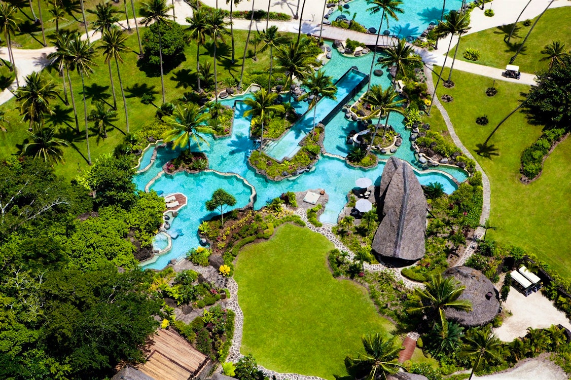 aerial view of pool and restaurant at como laucala island fiji