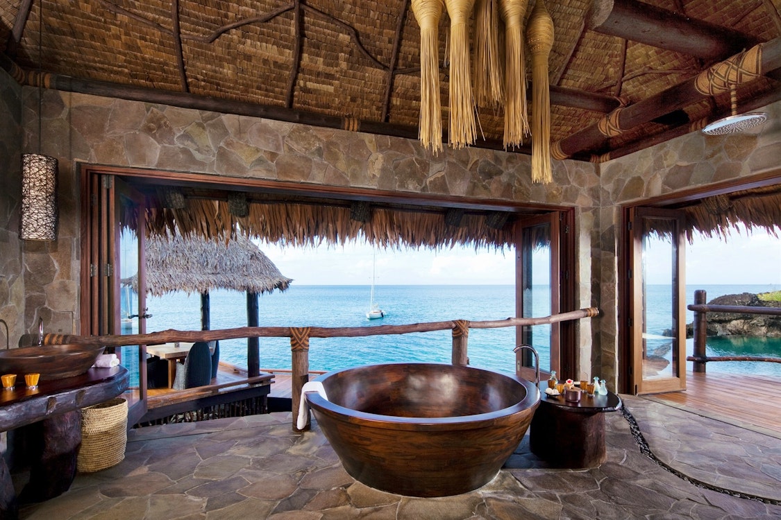 overwater villa bathroom at como laucala island fiji
