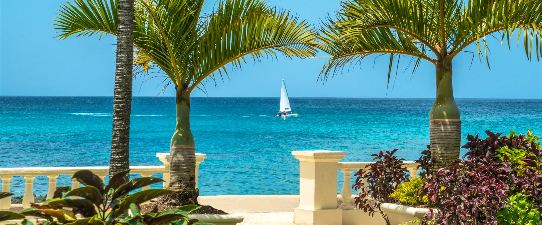 View of The Sea with Sailboat at Coral Reef Club, Barbados