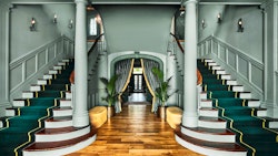 entrance hallway and grand staircase at the vanderbilt auberge resorts collection