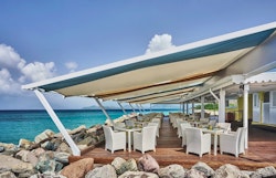 Mango outdoor seating area at Four Seasons Resort Nevis