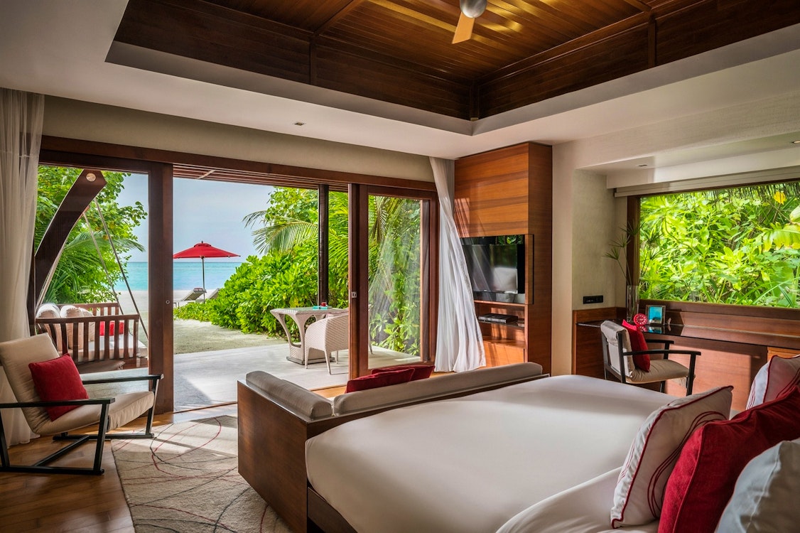 guest bedroom in deluxe beach villa niyama private islands maldives