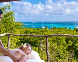 Enjoy a relaxing massage overlooking the ocean at Petit St. Vincent