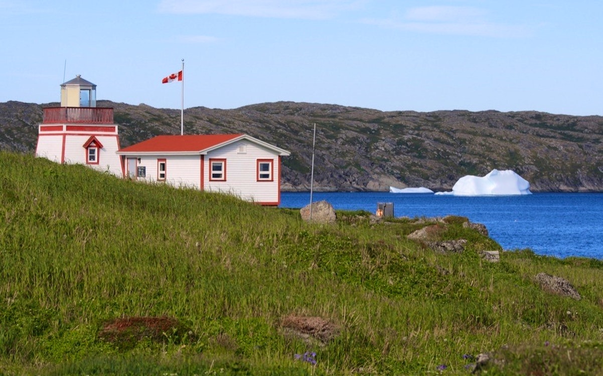 a lighthouse and keepers office at fishing point in st. anthony newfoundland canada