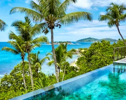 Infinity pool and loungers at six senses zil pasyon seychelles