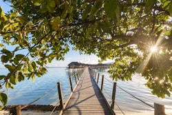 pontoon to overwater suites at le tahaa island resort spa tahiti french polynesia