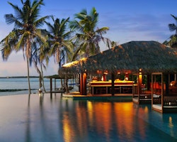 The Beach Bar by Dusk at The Residence Maldives, Indian Ocean