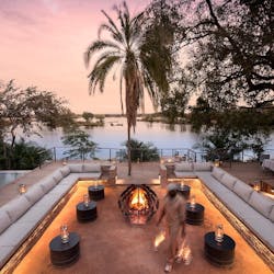 Lounge Area with Firepit at Thorntree River Lodge, Zambia
