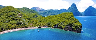 Enjoy free nights at this tropical beachfront hideaway close to St Lucia’s famous Pitons