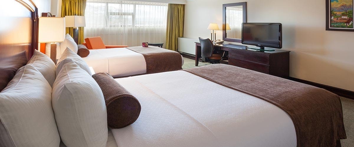 Bedroom at Crowne Plaza Corobici Hotel