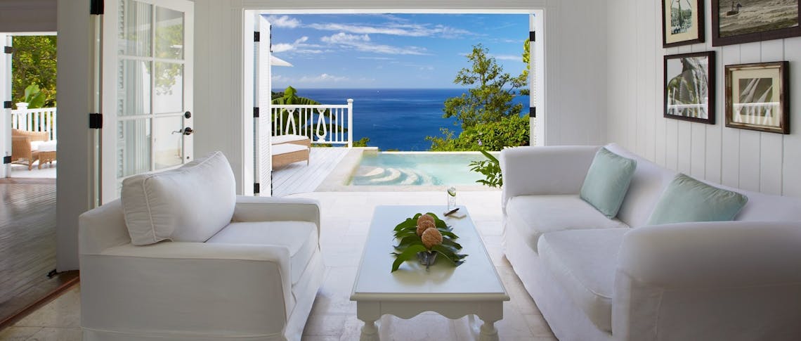 Living room area overlooking the ocean in Luxury Villa at Sugar Beach, A Viceroy Resort