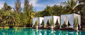 Book a romantic escape to this quiet boutique resort set on a beautiful beach in Khao Lak