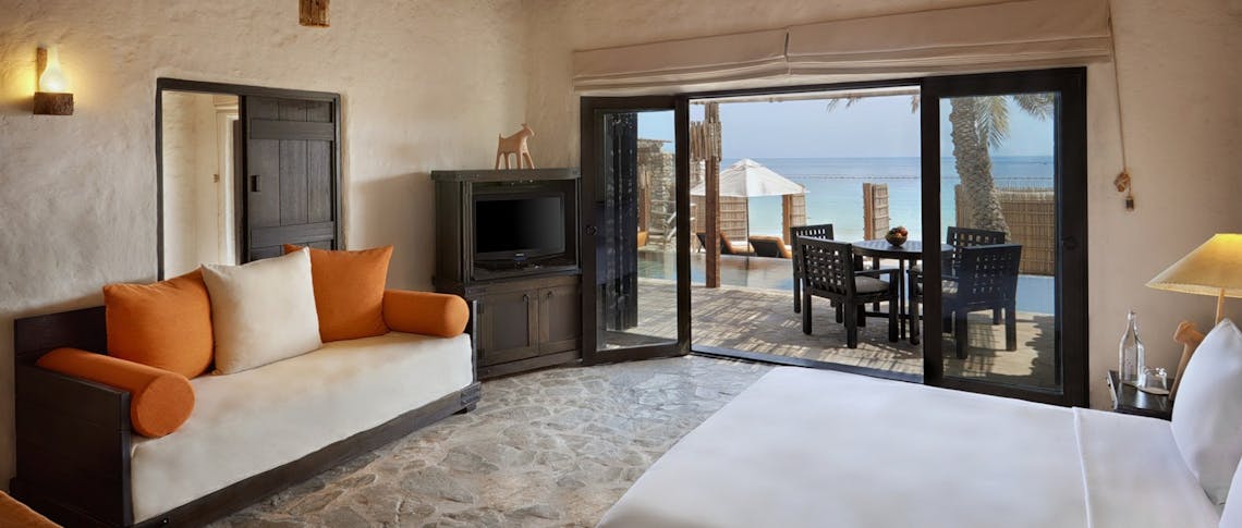 Pool villa suite beachfront bedroom at Six Senses Zighy Bay, Oman